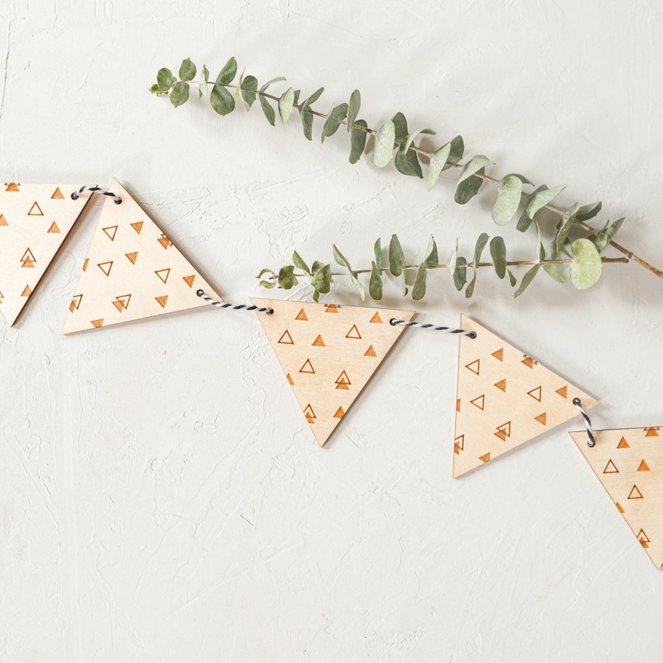 Wood Garland - triangle design laser cut and laser engraved in birch wood by LeeMo Designs in Bend, Oregon