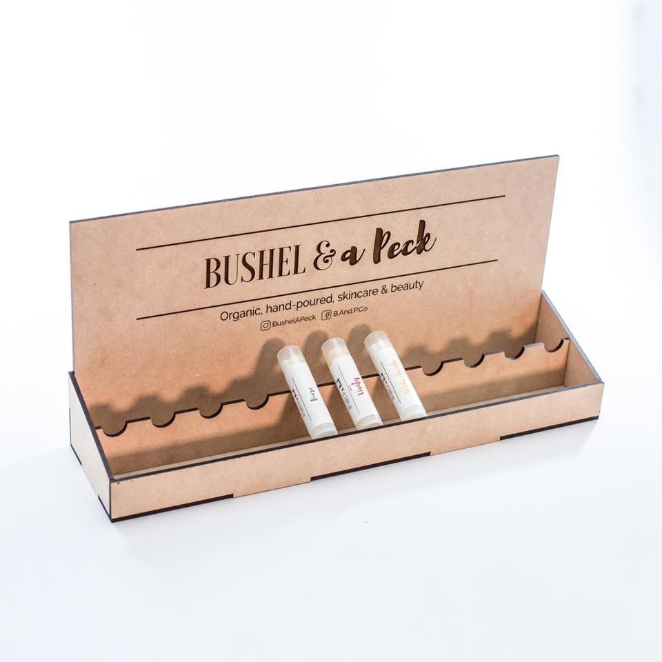 Custom Lip Balm Display Boxes - 11 Lip Balms - Bushel & A Peck Skincare with 3 lip balms in display by LeeMo Designs in Bend, Oregon