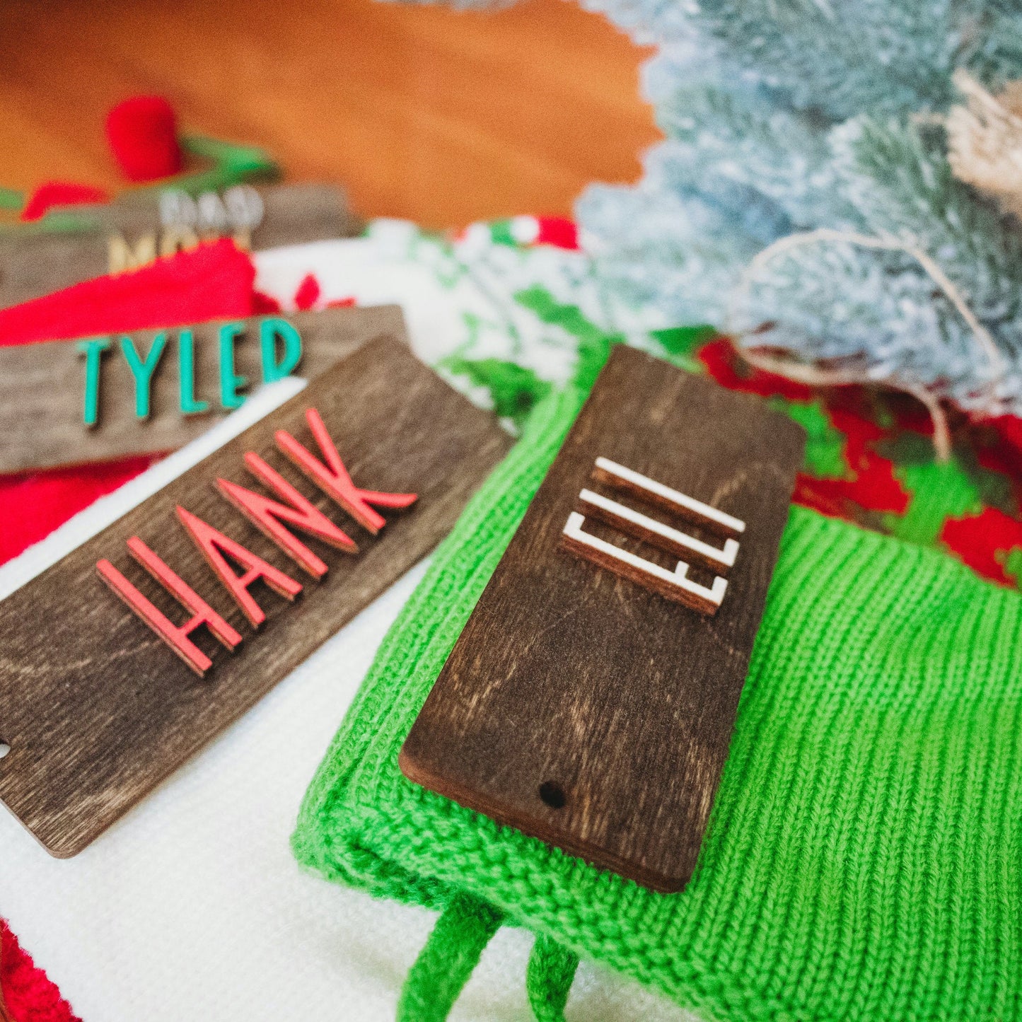 Personalized Wooden Stocking Tags, Modern Font - Dark Stained Laser Cut Wood with White, red, green lettering- Eli, Hank, Tyler - by LeeMo Designs in Bend, Oregon
