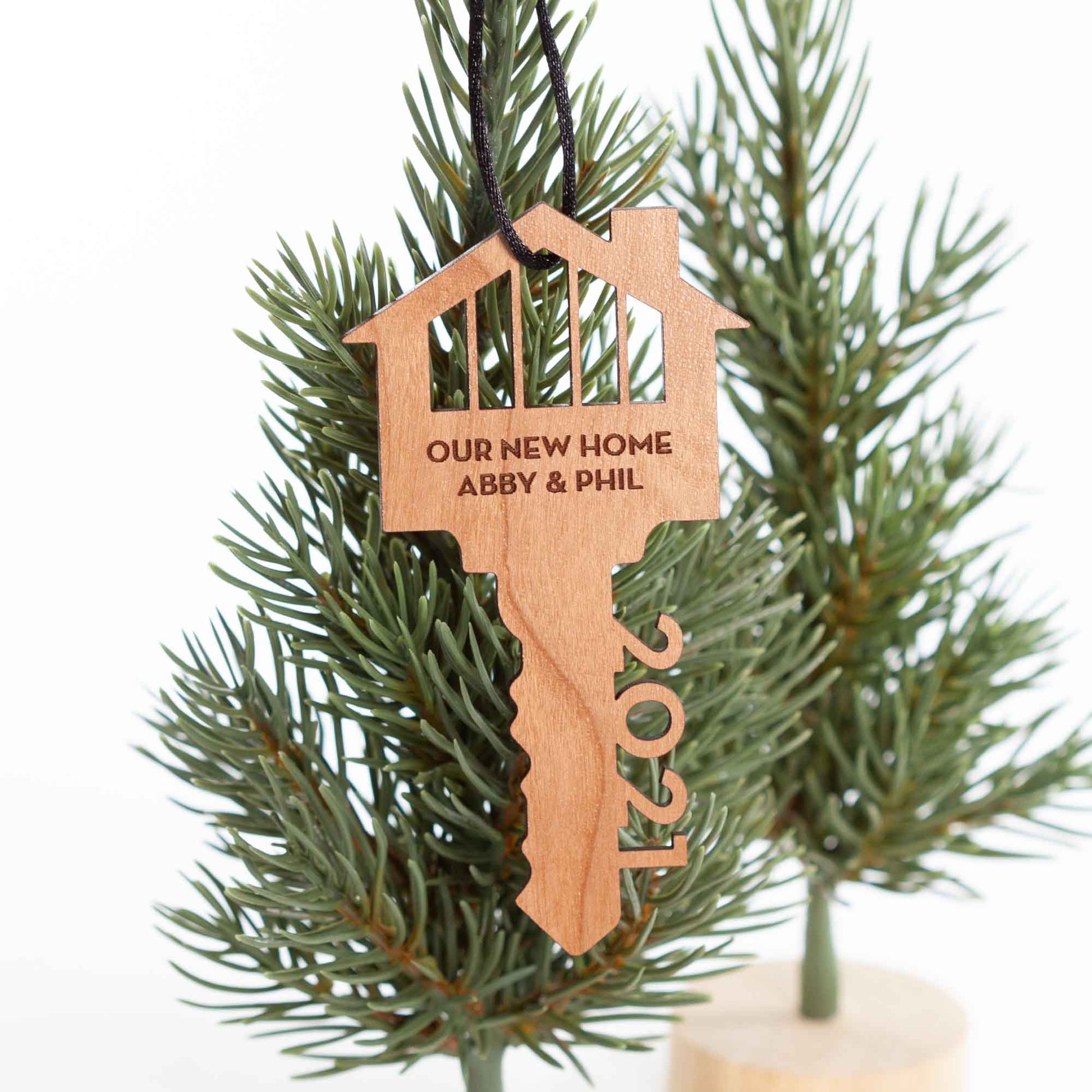 Custom Wood Ornaments - New Home Key Laser Cut and Laser Engraved in Cherry Wood by LeeMo Designs in Bend, Oregon
