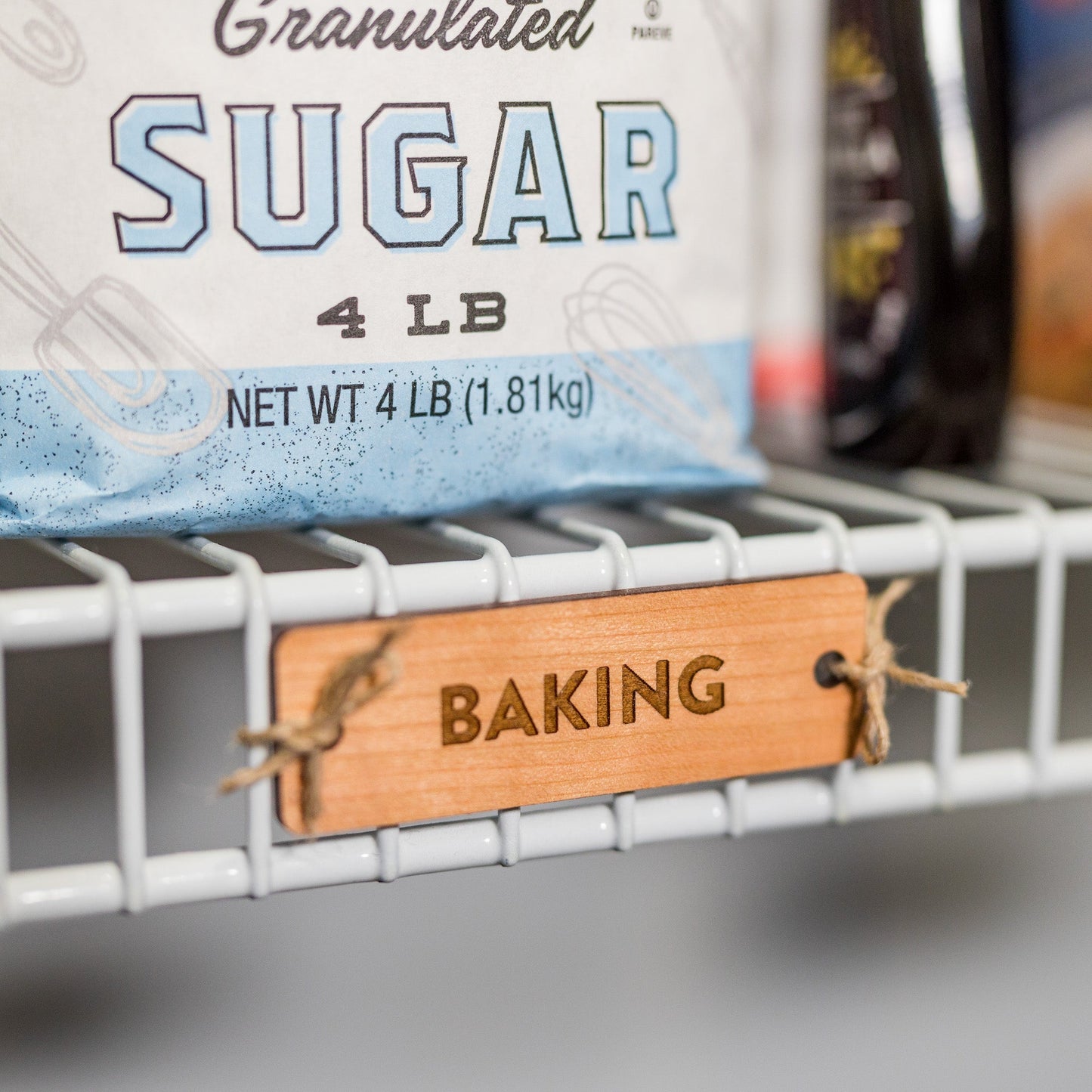 Tie-On Labels for Closet Organization - Cherry Wood Baking clean font on ventilated wire shelving - by LeeMo Designs in Bend, Oregon