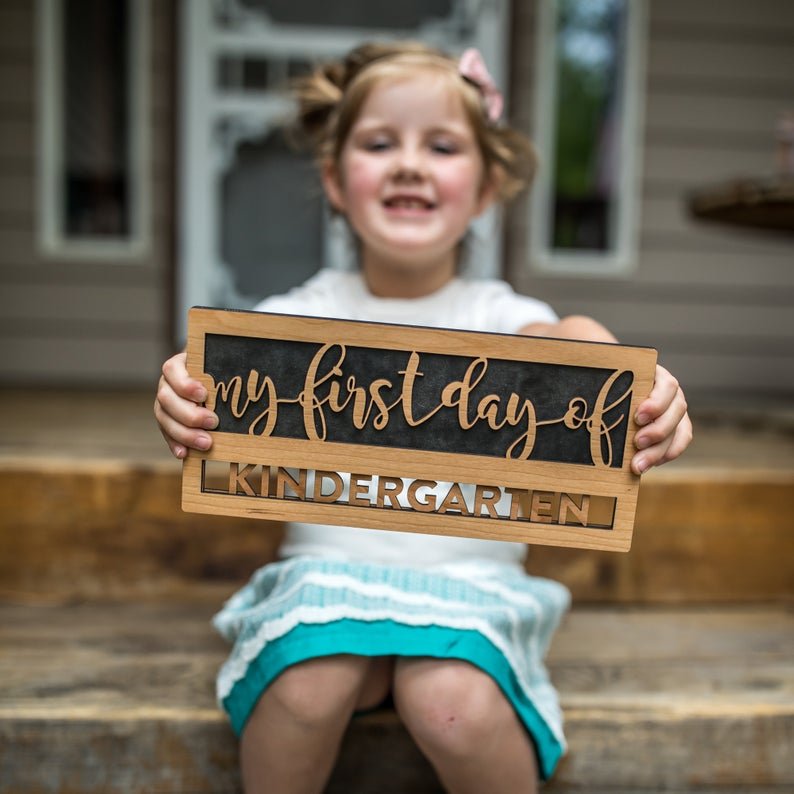 Reusable back-to-school wood sign - Cherry wood sign being held says "my first day of kindergarten" - By LeeMo Designs in Bend, Oregon